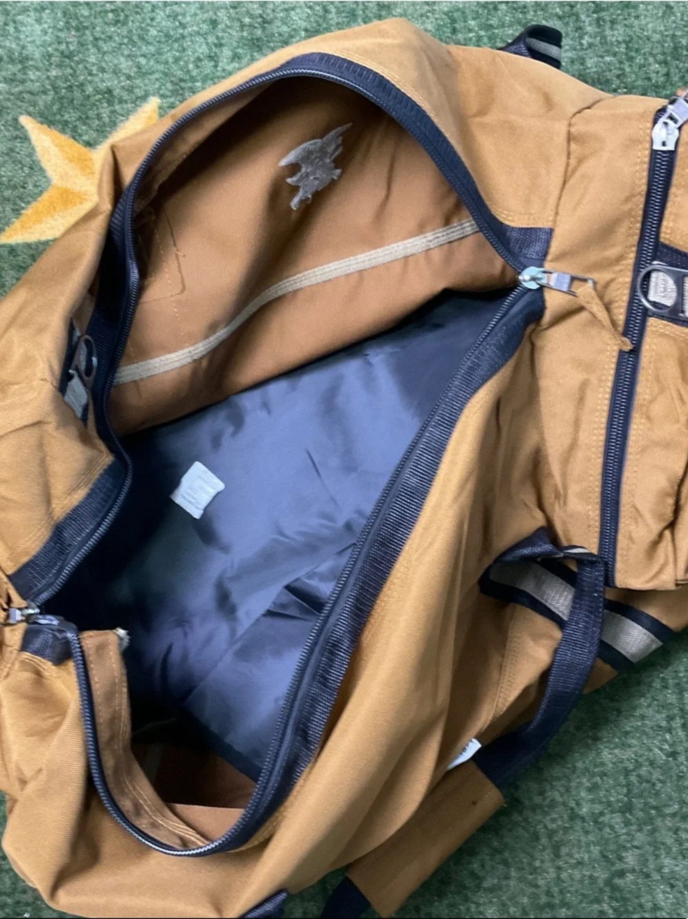 NRA SYMBOL Tan Canvas Duffel Bag with Navy Black Trim and Shoulder Strap